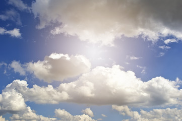 Obraz premium White fluffy clouds in the blue sky.