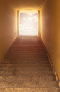 Heaven's gate. Staircase leading to open door and sky.