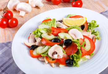 Fresh vegetable salad on the wooden table
