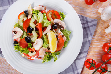 Fresh vegetable salad on the wooden table