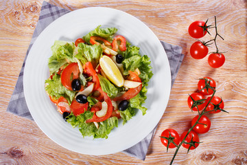 Fresh vegetable salad on the wooden table