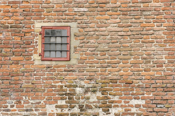 Old fortress wall with window.