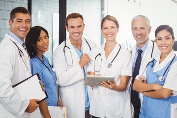 Fototapeta premium Portrait of medical team standing with digital tablet and clipboard