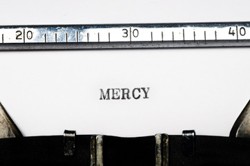 word mercy typed on typewriter