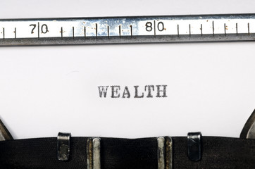 word wealth typed on typewriter