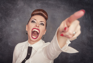 Angry screaming woman pointing out