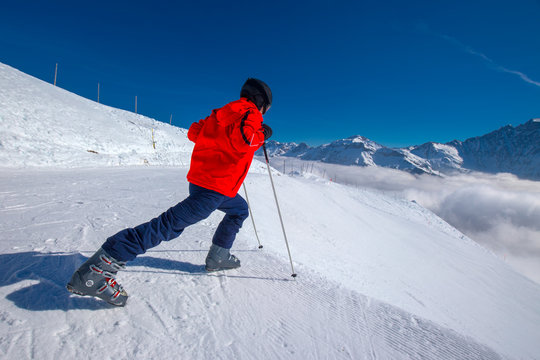 Young skier warming-up before skiing in Elm ski resort, Switzerland