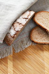 Fototapeta na wymiar Sliced loaf of gray floured bread