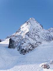 Stubai Alpen glacier peak with pistes in winter