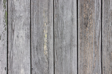 Fototapeta premium Gray wooden desks peeling paint background.