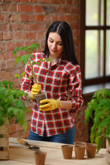 Portrait of a charming young female gardening