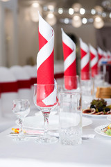 Dining table setting at Provence style, with candles, lavender, vintage crockery and cutlery,