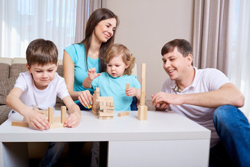 Obraz na płótnie Canvas happy family playing together at home