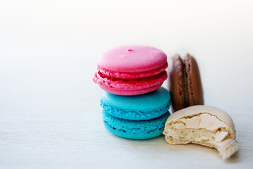 Colorful macaroons tower close-up on whitebackground. 