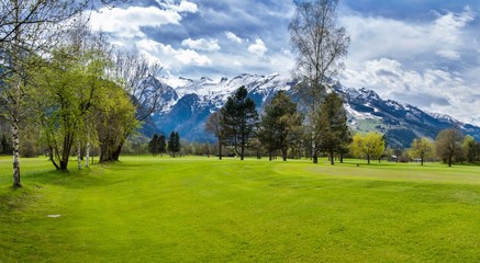 Fototapeta na wymiar Panorama of golf resort with cottage