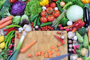 Fototapeta na wymiar Fresh vegetables and chopping carrot on chopping board