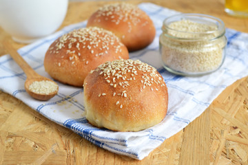 homemade buns with sesame seeds and milk for breakfast