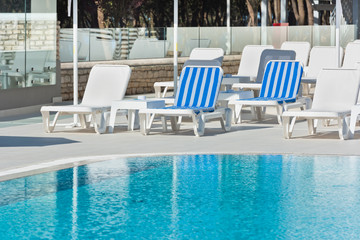 Hotel Poolside Chairs near a swimming pool