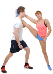 Fototapeta na wymiar Beautiful young woman and man doing stretching exercises