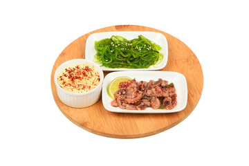 Two seafood salads on wooden plate