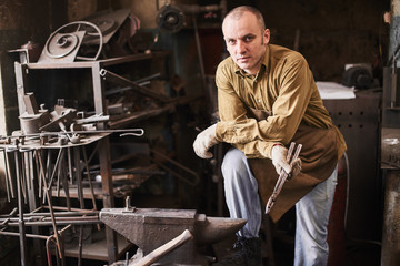 Fototapeta na wymiar Portrait of a forge in the workshop