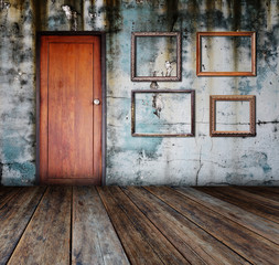 Picture frame put on wall in grunge room.