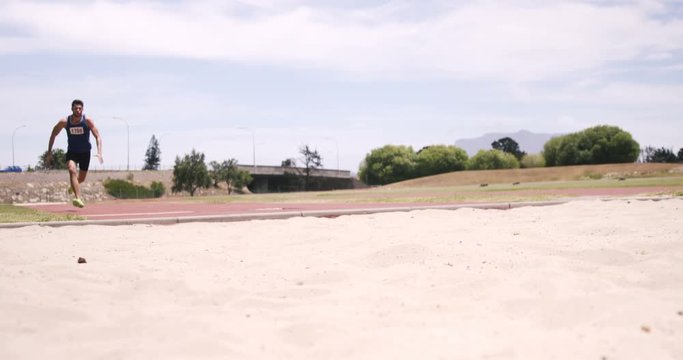 Sportsman doing long jump
