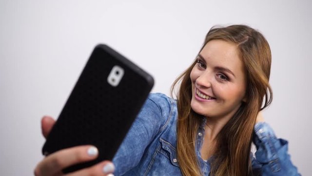 Woman taking self picture selfie with  mobile phone 4K