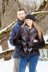 Happy Young Couple in Winter garden