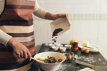 Beautiful woman Preparing Cookies And Muffins.
