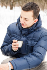 Man warming up with hot tea