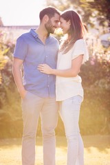 Fototapeta premium Couple embracing and romancing at park