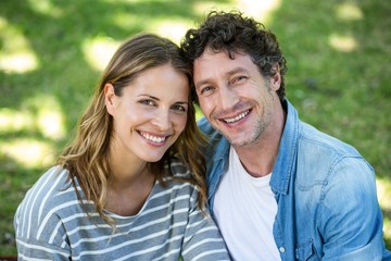 Fototapeta premium Couple sitting on the lawn