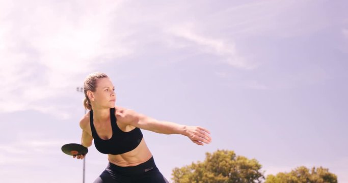 Sportswoman practicing discus