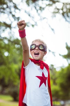 Little boy pretending to be superhero