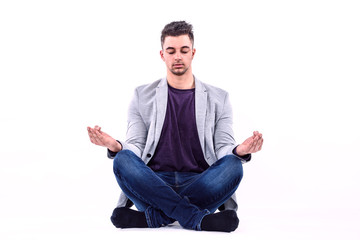 Young Businessman Meditating Isolated on White