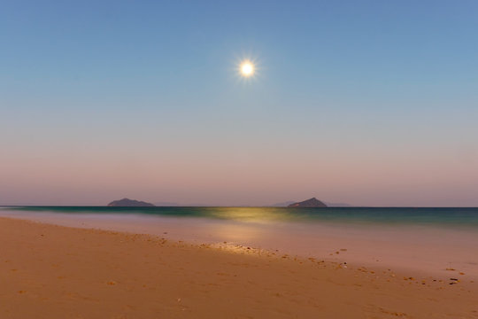background of the moon in the sky over the sea at bulone island,