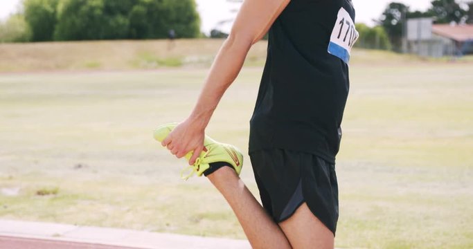 Focused sportsman stretching