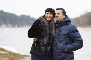 Couple playing on the coast