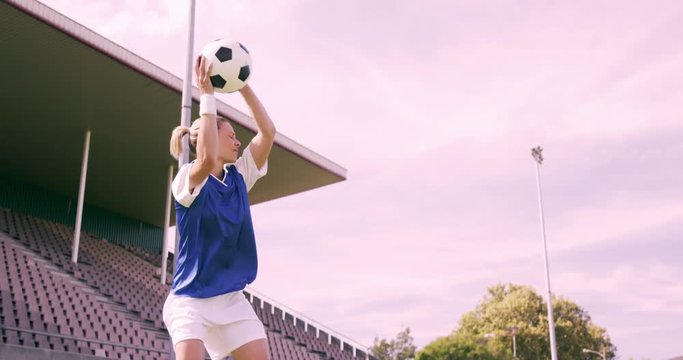 Football player throwing ball