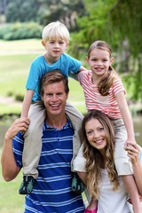 Fototapeta premium Portrait of happy family enjoying in the park