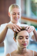 Fototapeta premium Woman receiving a head massage