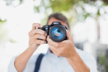 Close-up of man holding camera