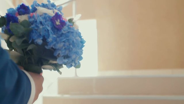 stylish elegant bride holds a lush bouquet of flowers