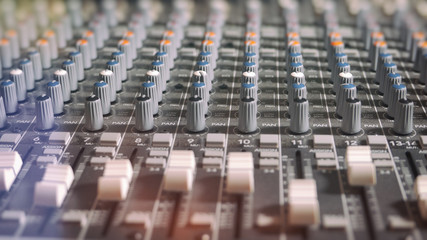 Mixing Board Classic Knobs. Pro audio mixing board faders and knobs, multi-track music recording equipment.