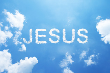 Clouds word "JESUS" in capital letters on blue sky