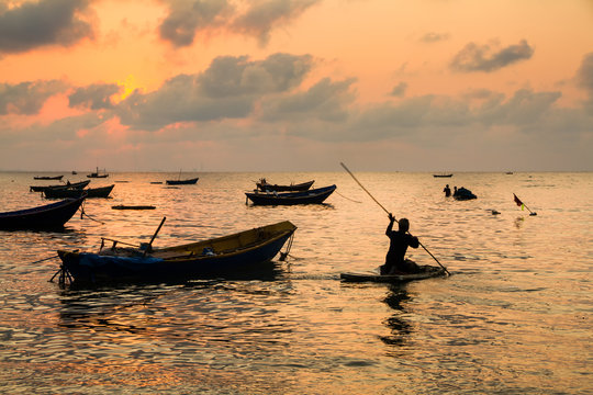 Fishing boats, small boats floating in the sea at sunrise, Conce