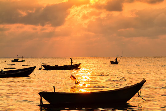 Fishing boats, small boats floating in the sea at sunrise, Conce