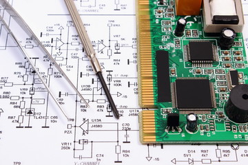 Printed circuit board and precision tools on diagram of electronics, technology