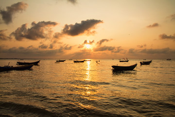 Naklejka premium Fishing boats, small boats floating in the sea at sunrise, Conce